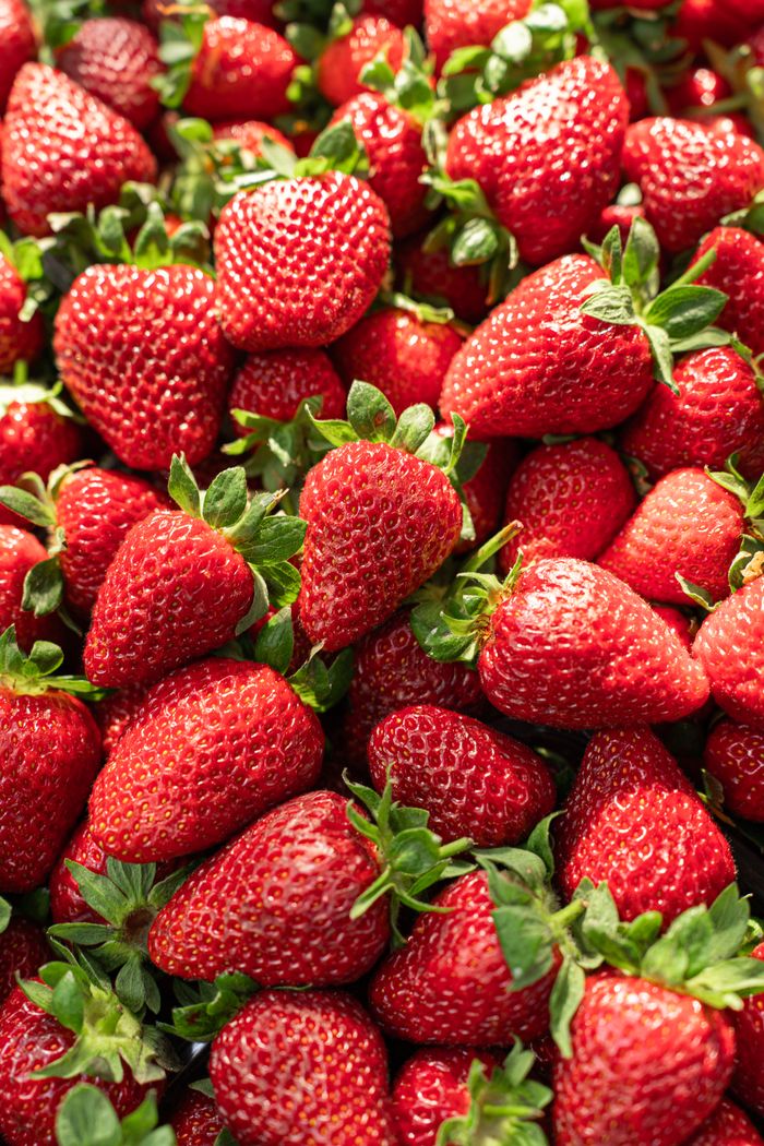 A vibrant display of ripe red strawberries, ideal for food-related content.